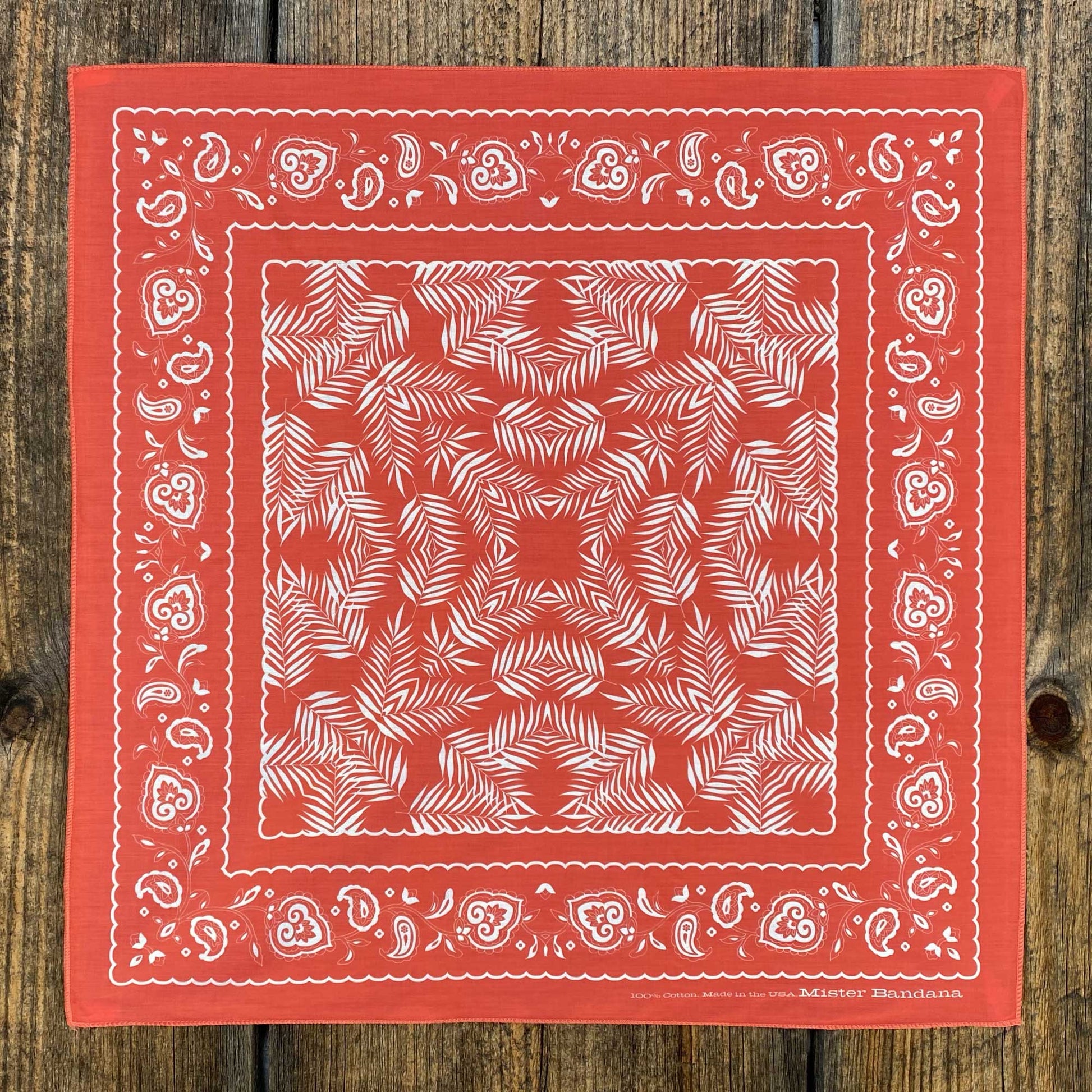 Our classic Wild Palms design, now in silky coral red. Inspired by the traditional cowboy scarf, this bandana easily ties into a Western knot, or pairs great with our Bison Leather Woggle. Material: 100% silky pima cotton. Provenance: printed and assembled in North Carolina. 21.5" x 21.5". Made in the USA 🇺🇸
